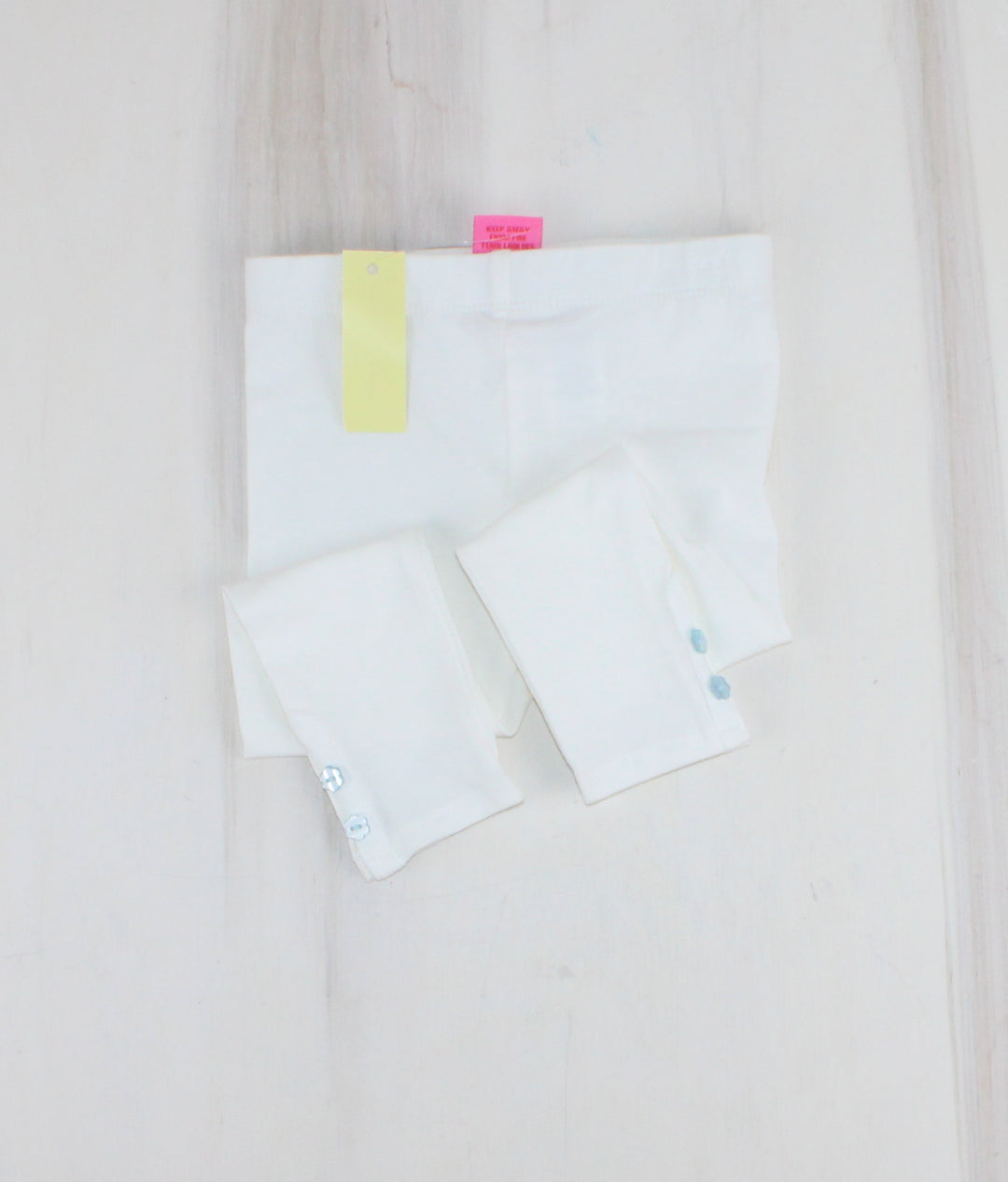 WHITE LEGGINGS WITH BLUE BOTTONS 24M PRE-LOVED
