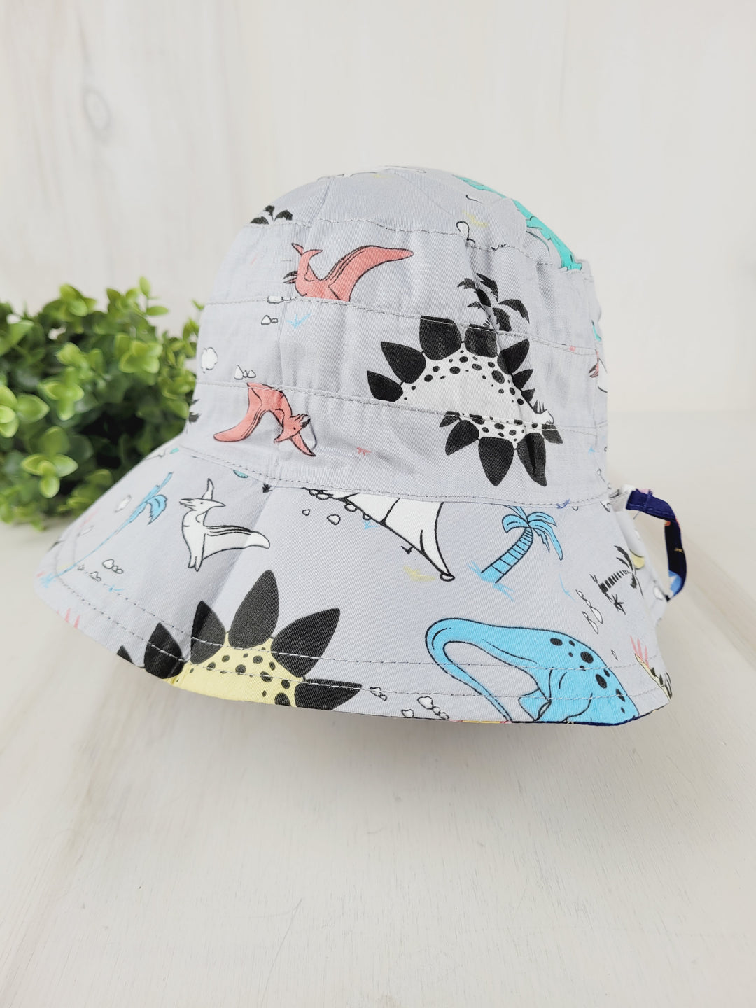 MINI ANGEL REVERSIBLE SUNHATS - SPACE/DINO DESIGN 3-4Y PRE-LOVED